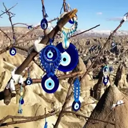 Evil eye tree in Cappadocia, adorned with traditional Turkish charms