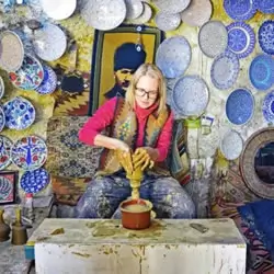 Traditional pottery workshop demonstration in Cappadocia, with local artisan shaping clay